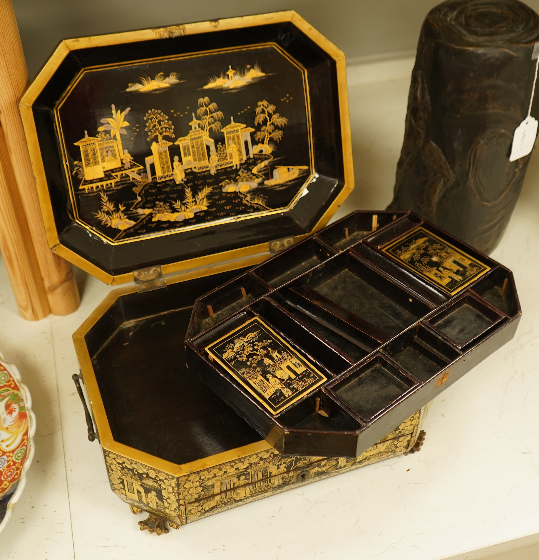 A Chinese export octagonal lacquered work box with fitted interior, 35cm wide